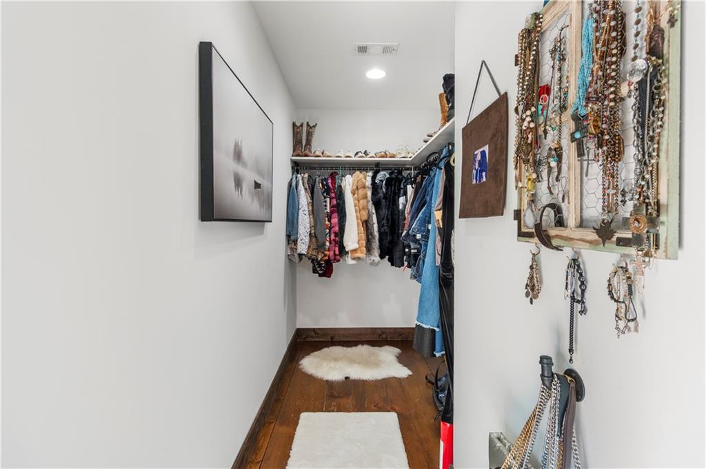 308 Hugh Stowers Road Dawsonville, GA 30534 - Photo 36 of 81 a view of walk in closet with clothes and shoes