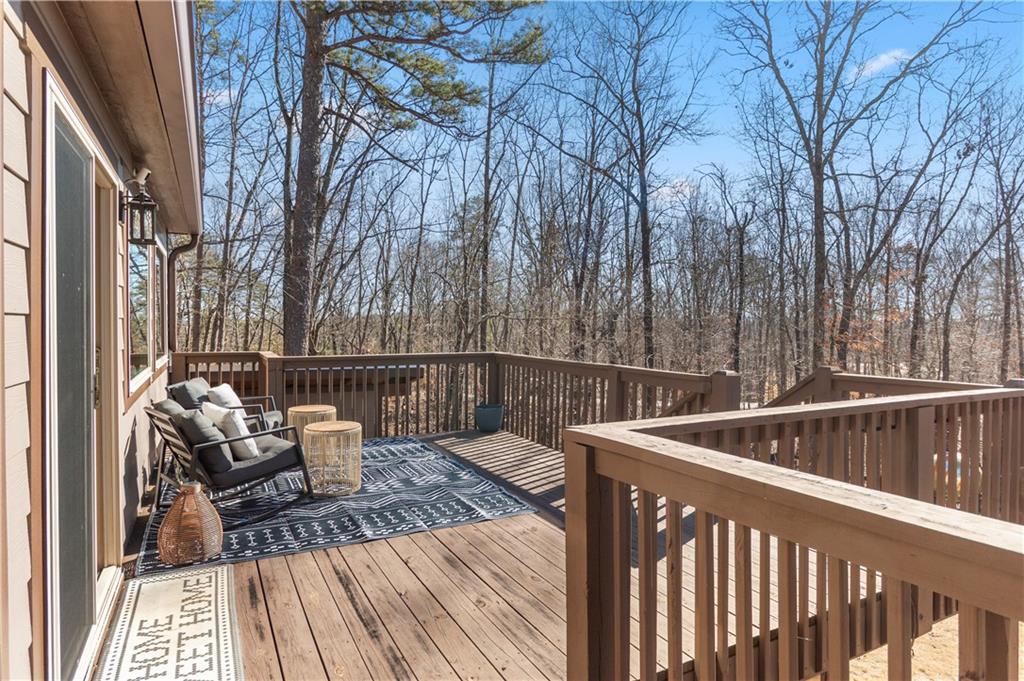 308 Hugh Stowers Road Dawsonville, GA 30534 - Photo 48 of 81 a balcony with wooden floor and furniture