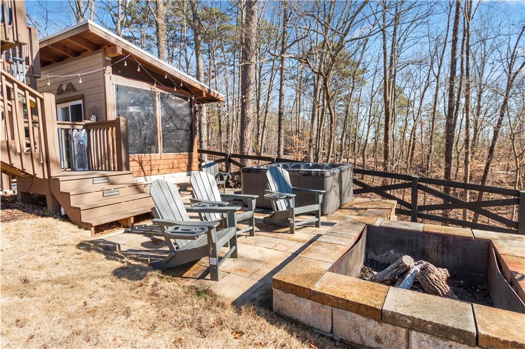 308 Hugh Stowers Road Dawsonville, GA 30534 - Photo 58 of 81 a view of backyard with swimming pool and seating space
