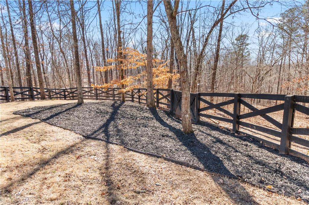 308 Hugh Stowers Road Dawsonville, GA 30534 - Photo 61 of 81 a view of a yard with wooden fence