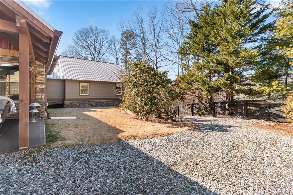 308 Hugh Stowers Road Dawsonville, GA 30534 - Photo 63 of 81 a view of a yard with a tree