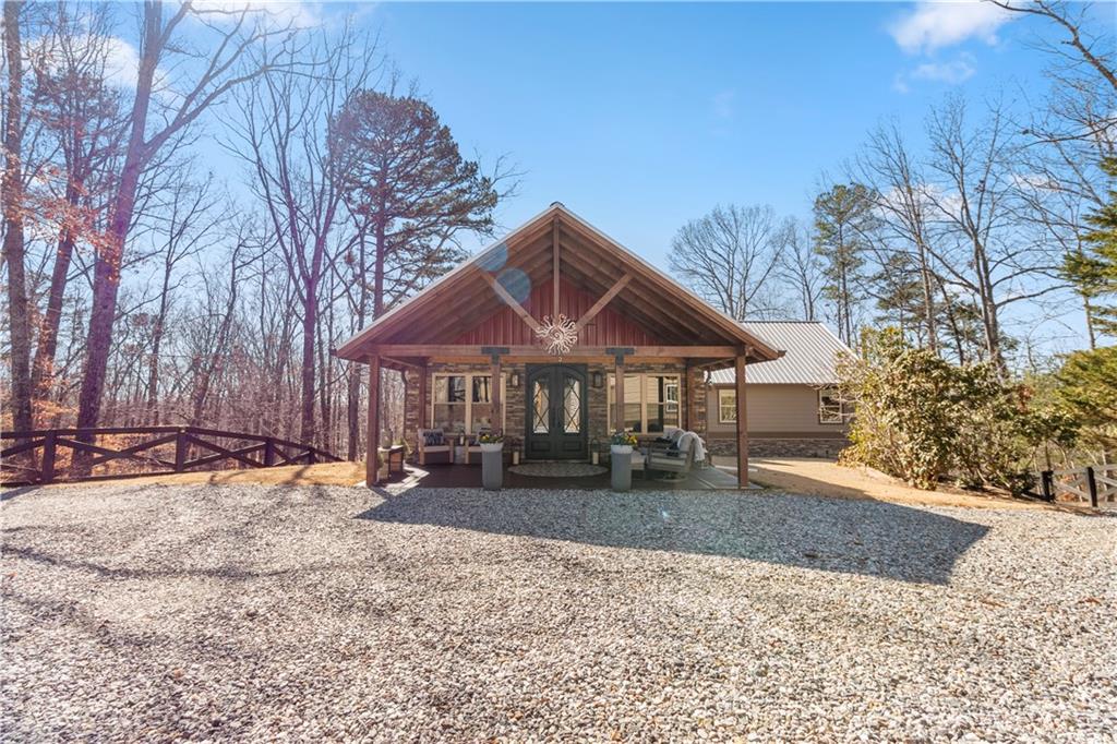 308 Hugh Stowers Road Dawsonville, GA 30534 - Photo 67 of 81 a front view of a house with a yard covered with snow in front of house