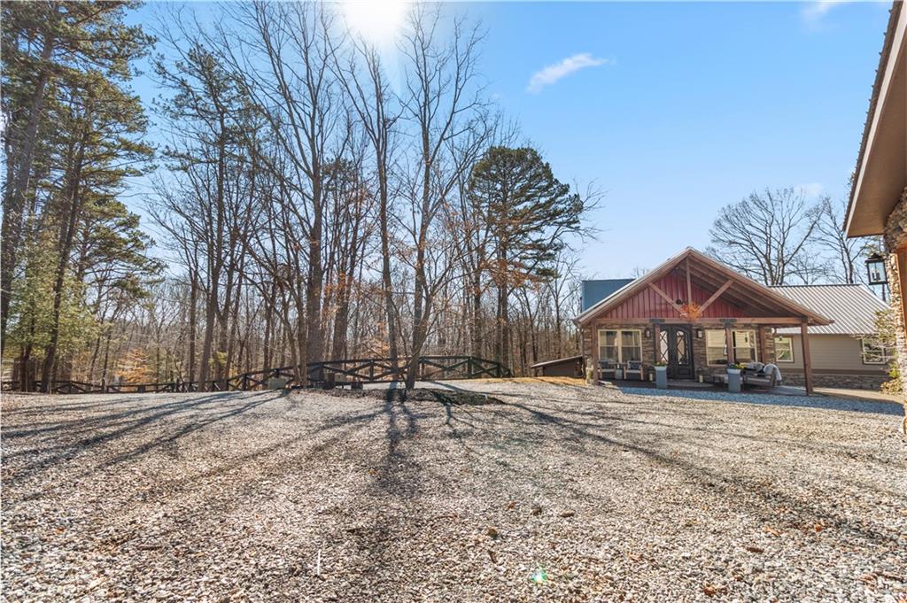 308 Hugh Stowers Road Dawsonville, GA 30534 - Photo 69 of 81 a backyard of a house with a tree