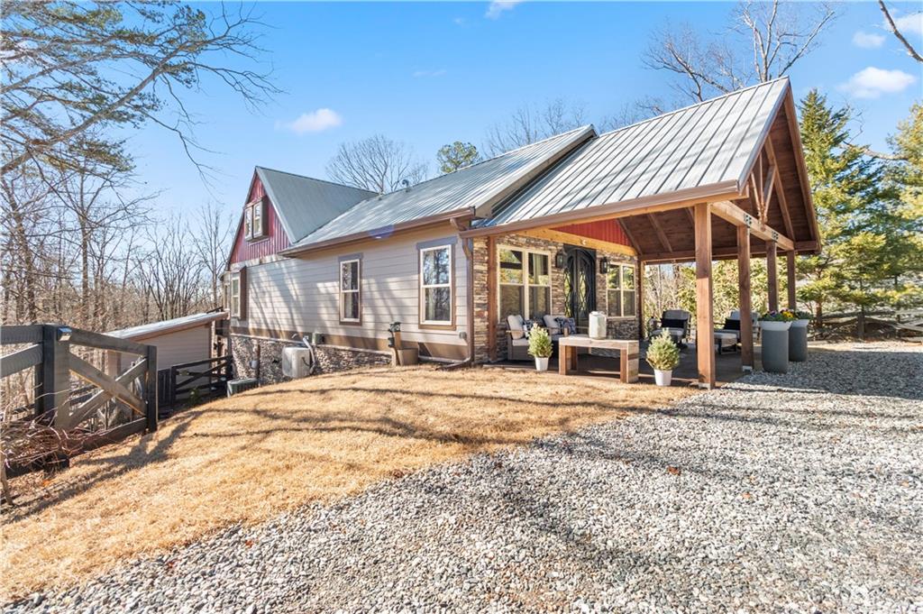 308 Hugh Stowers Road Dawsonville, GA 30534 - Photo 73 of 81 a view of a house with backyard and sitting area