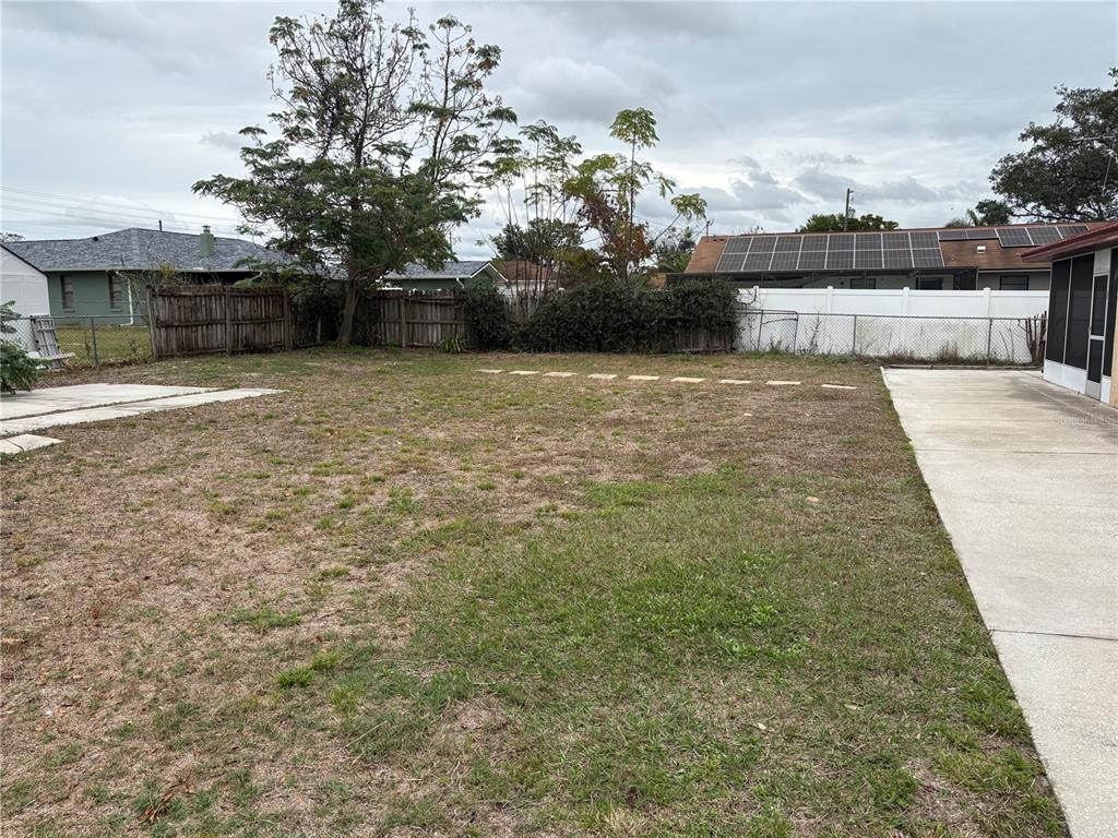 10305 Bannister Street Spring Hill, FL 34608 - Photo 7 of 24 a view of a house with a yard