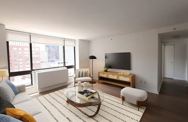 a living room with furniture and a window