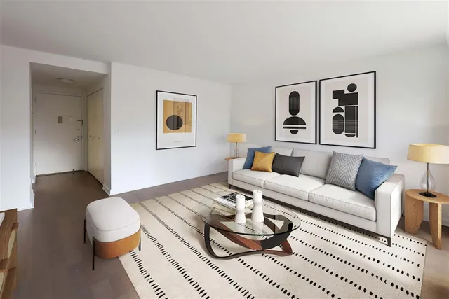 a living room with furniture and a rug