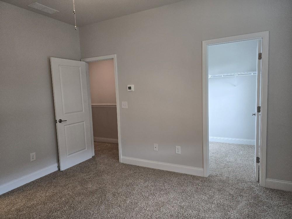 6190 Ripple Way, Unit 85 Atlanta, GA 30349 - Photo 13 of 16 an empty room with closet area