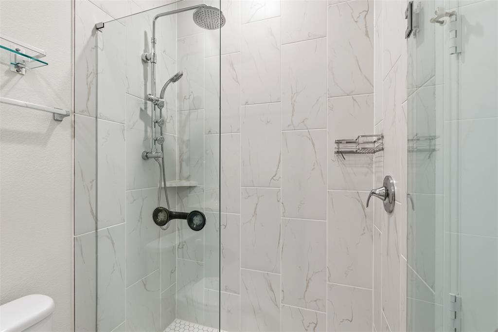 4400 Rocky Rdg Trail Little Elm, TX 75068 - Photo 11 of 40 a bathroom with a shower