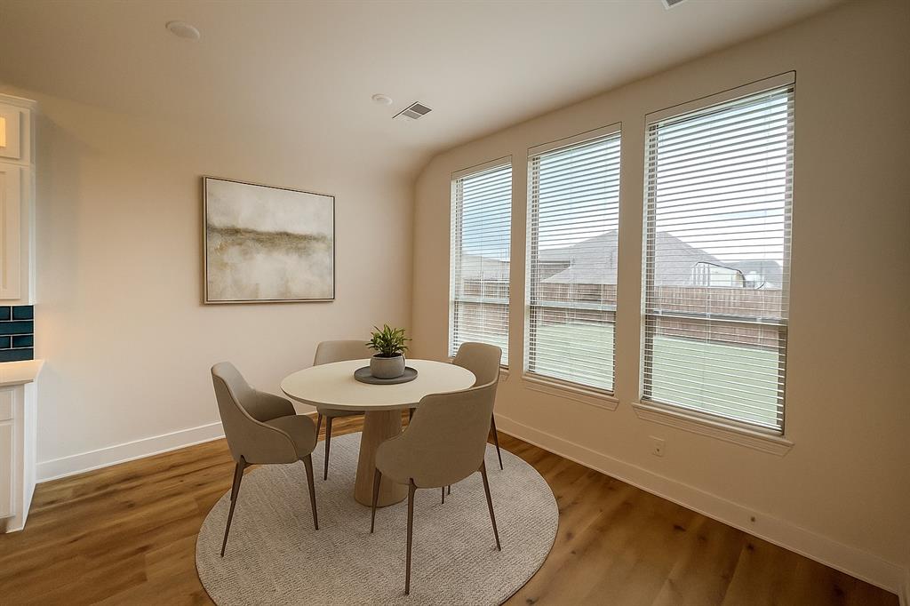 4400 Rocky Rdg Trail Little Elm, TX 75068 - Photo 18 of 40 Virtually Staged Breakfast area space with baseboards and wood finished floors