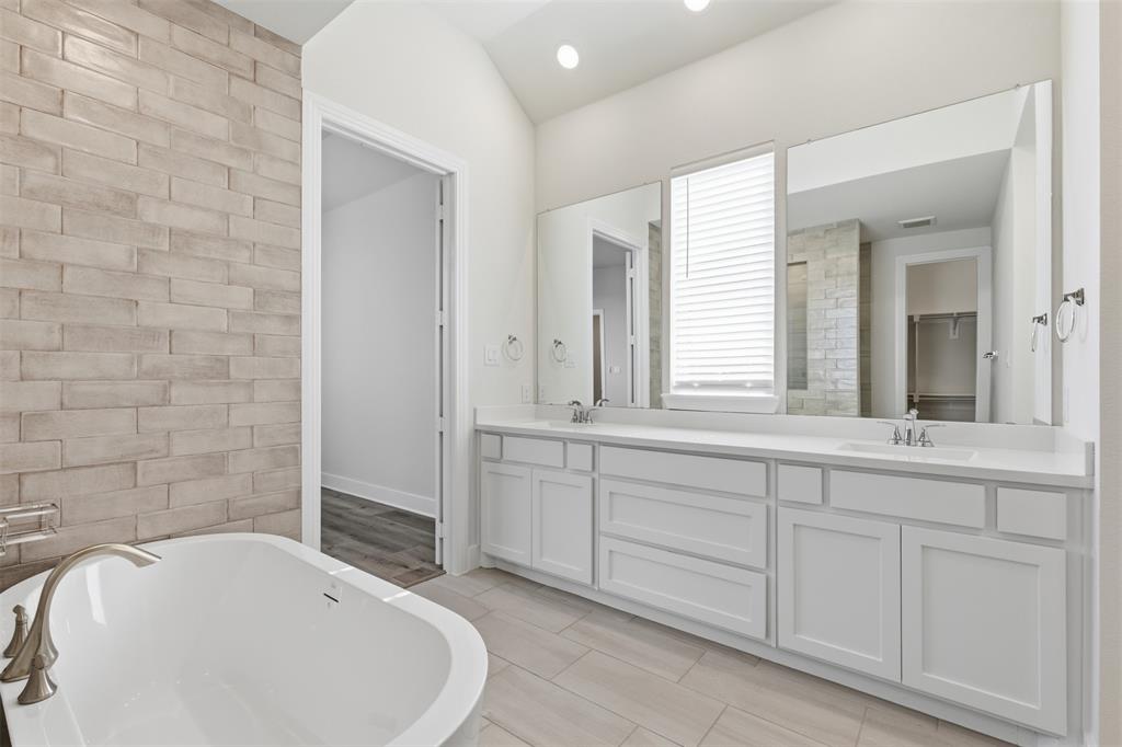 4400 Rocky Rdg Trail Little Elm, TX 75068 - Photo 22 of 40 a bathroom with a sink and a bathtub