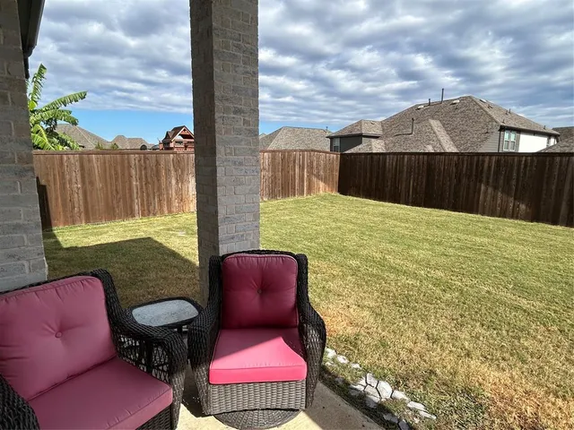 a backyard of a house with seating space