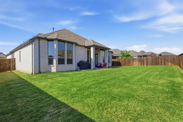 an aerial view of a swimming pool patio and outdoor seating
