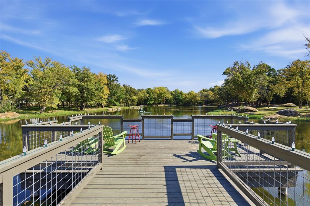 4400 Rocky Rdg Trail Little Elm, TX 75068 - Photo 32 of 40 a view of a balcony with wooden floor and seating space