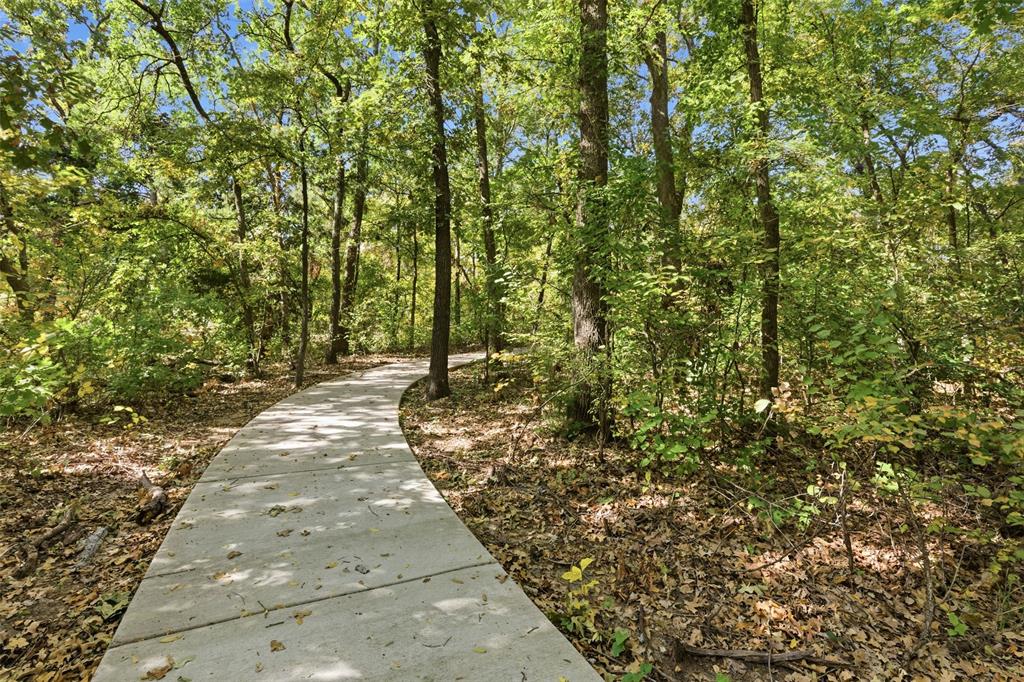 4400 Rocky Rdg Trail Little Elm, TX 75068 - Photo 37 of 40 a view of a yard with plants and trees