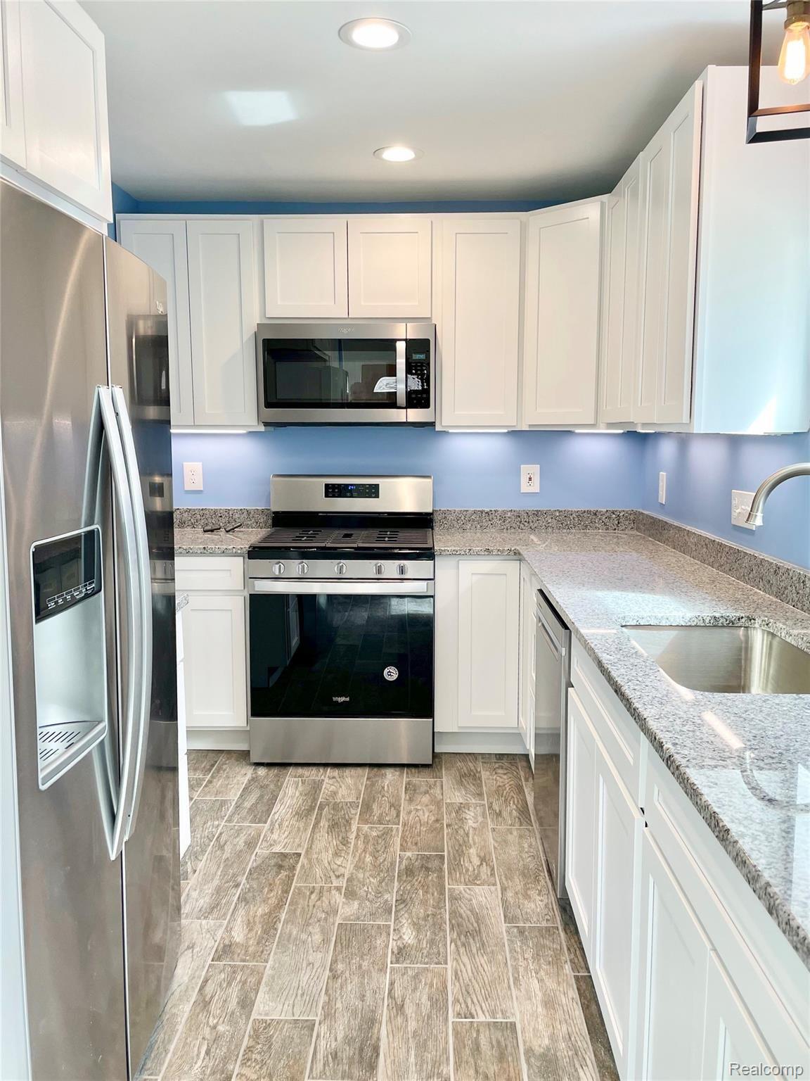 9089 Beech Daly Road Taylor, MI 48180 - Photo 20 of 42 Porcelain flooring, recessed lighting. Modern appliances.