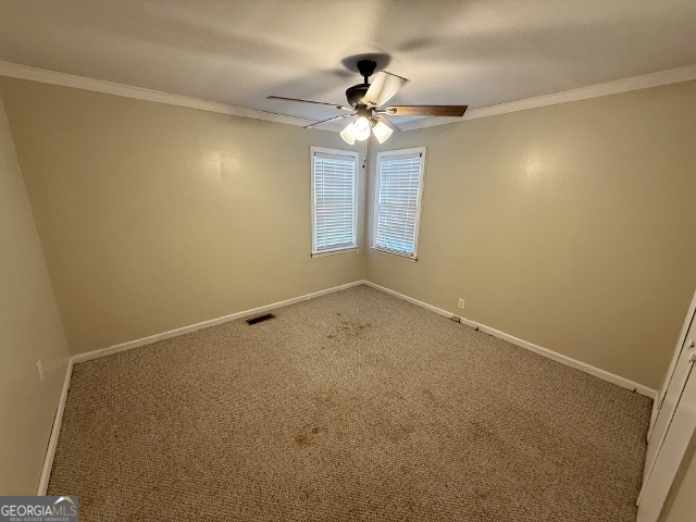 451 Lambs Bridge Road Swainsboro, GA 30401 - Photo 13 of 23 an empty room with a ceiling fan and a window
