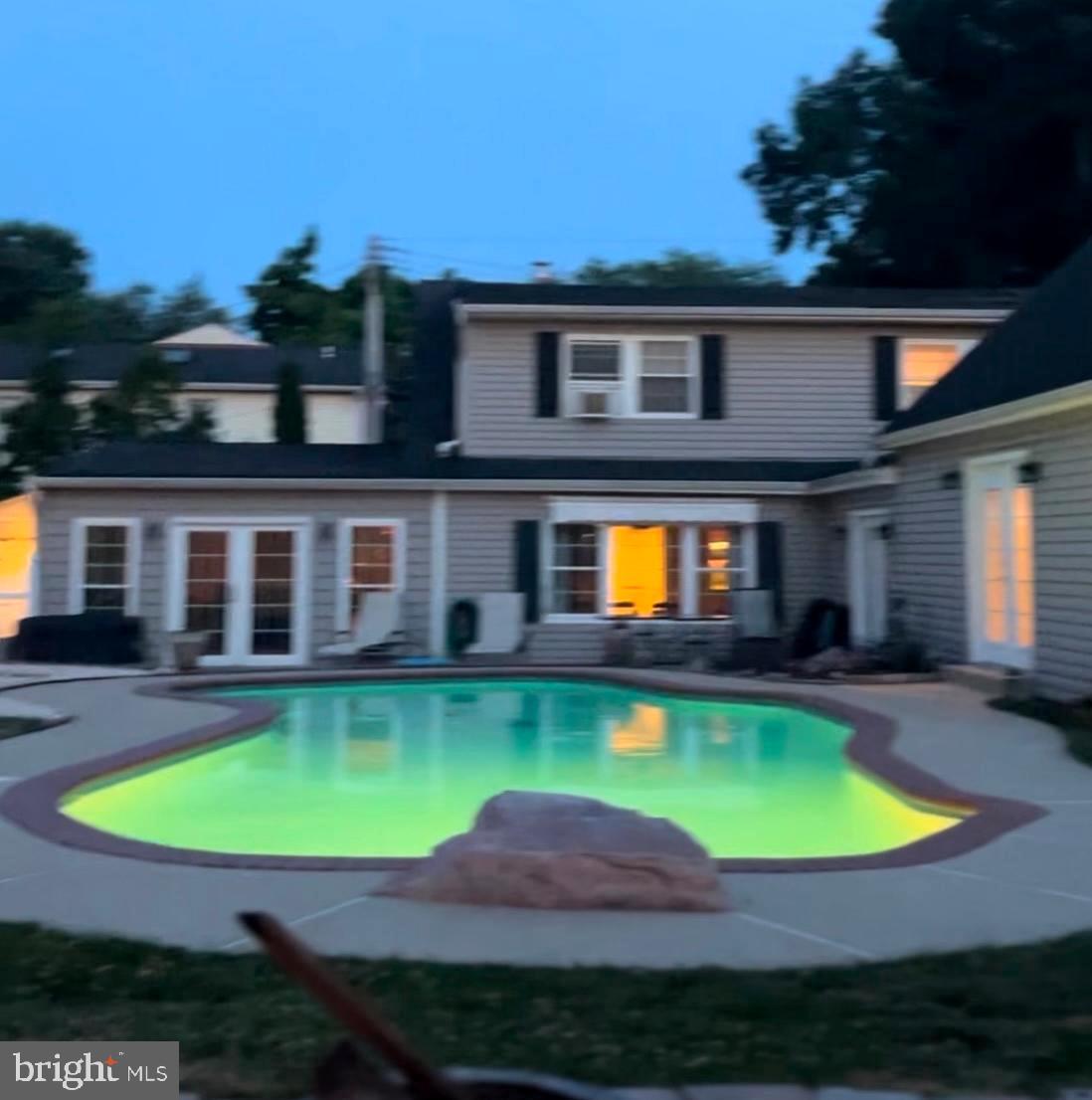 3107 Newton Road Sparrows Point, MD 21219 - Photo 1 of 29 a view of a swimming pool with a yard and plants