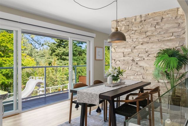 a very nice looking room with a large window with furniture