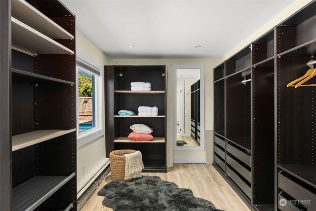 a bathroom with a shower and a glass door