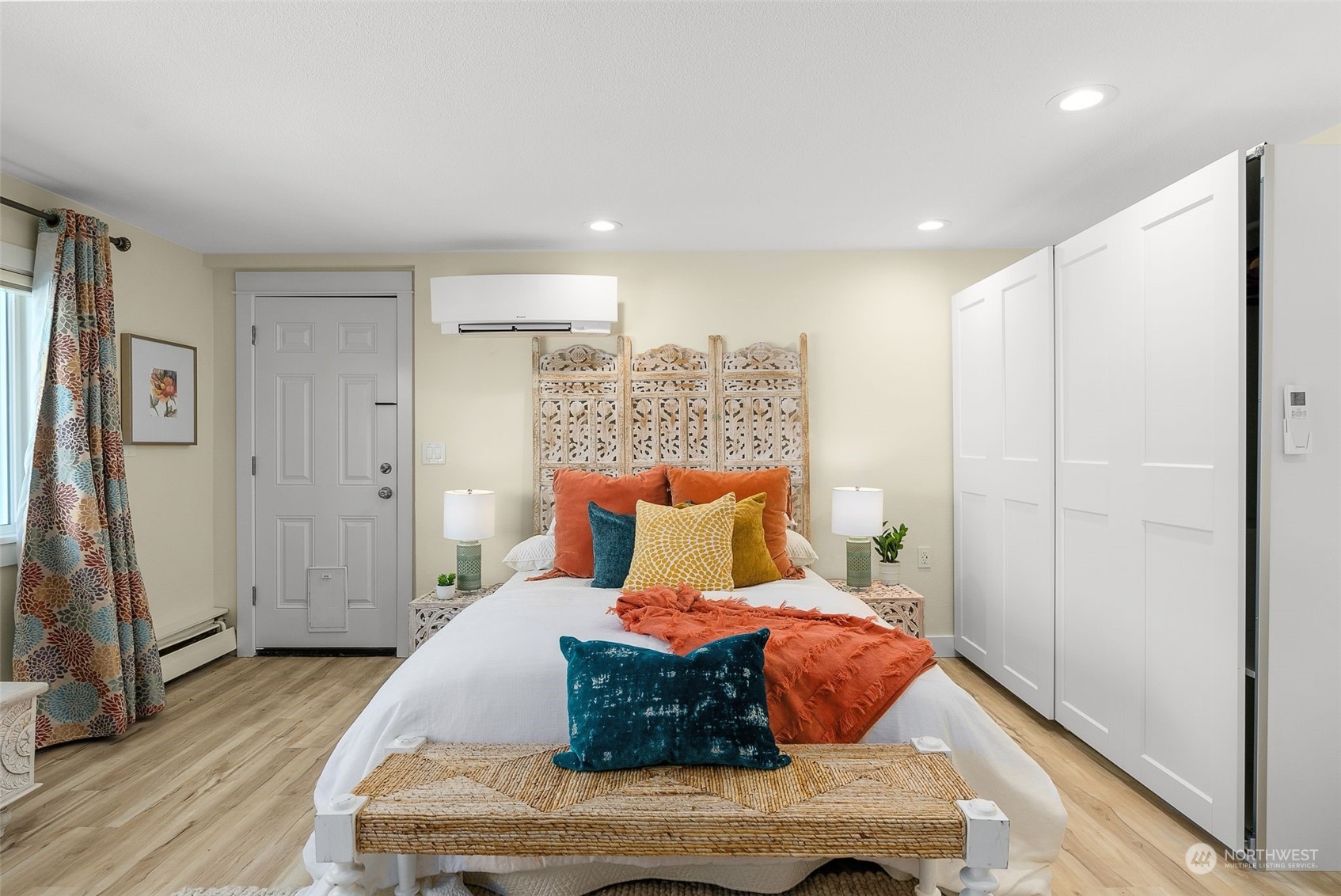8423 Tillicum Road Southwest Seattle, WA 98136 - Photo 24 of 35 a bedroom with a bed and wooden floor