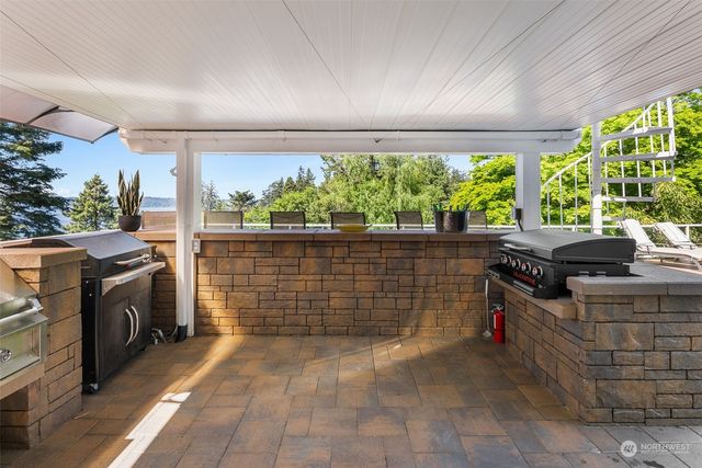 a view of a swimming pool with seating area and furniture