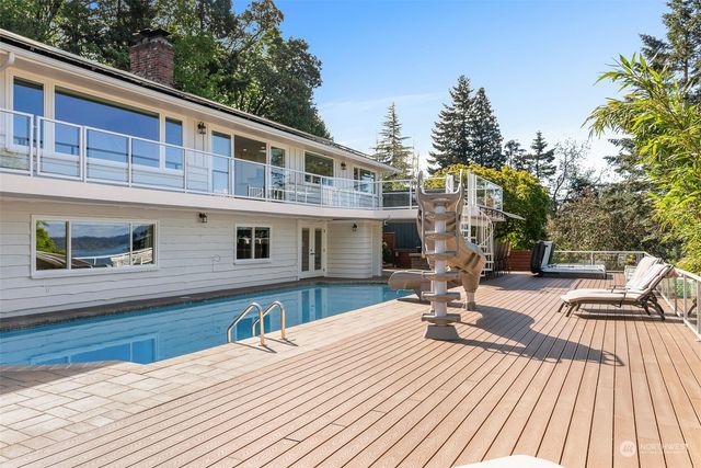 a view of a patio with table and chairs a barbeque