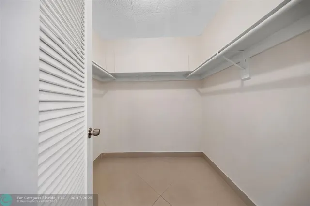 a bathroom with a sink toilet vanity and tub