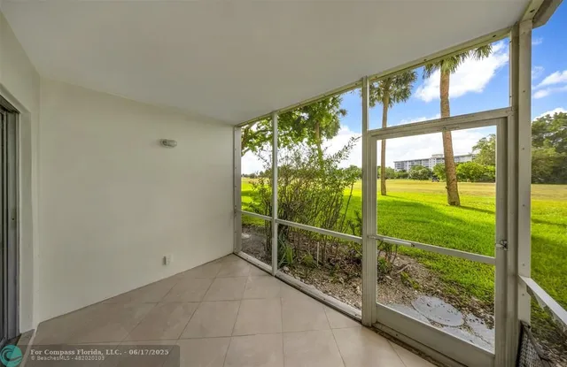 a view of a porch and garden