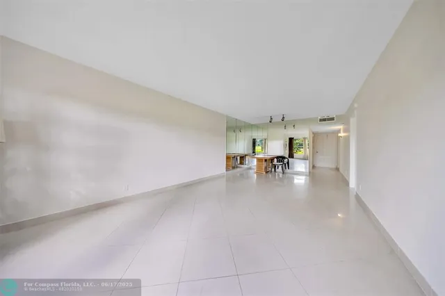 a view of a livingroom with furniture and a window