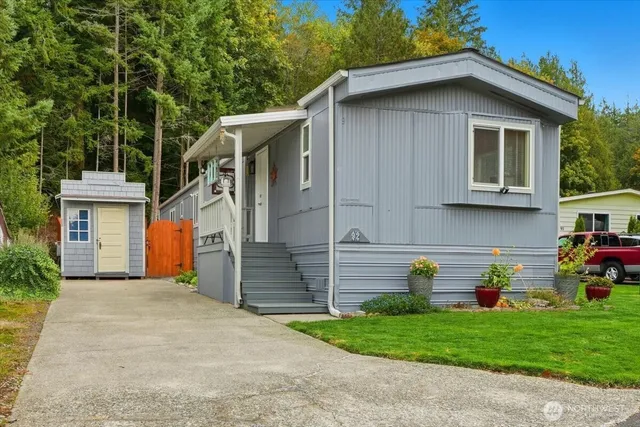 a view of a house with a yard and garage
