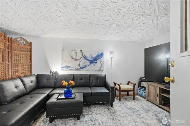 a living room with furniture a couch and a window