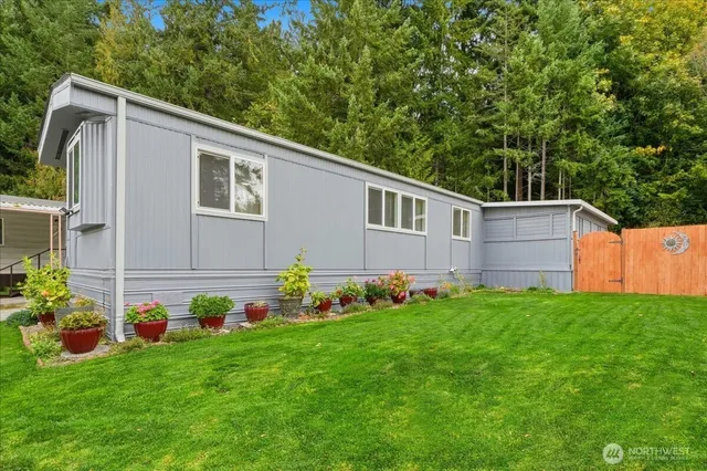 a backyard of a house with lots of green space