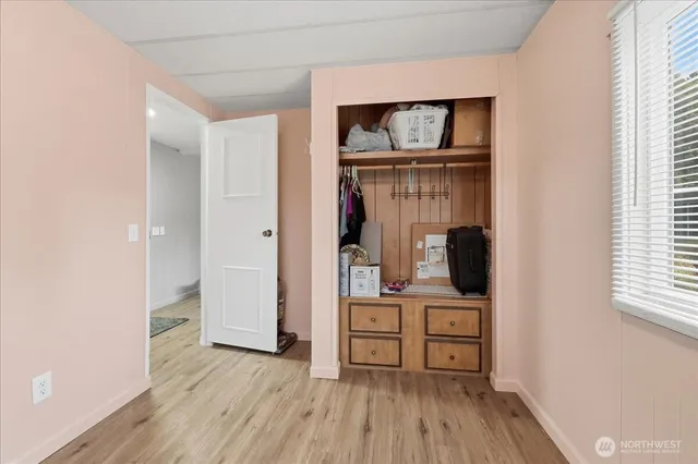 a view of kitchen with furniture and wooden floor