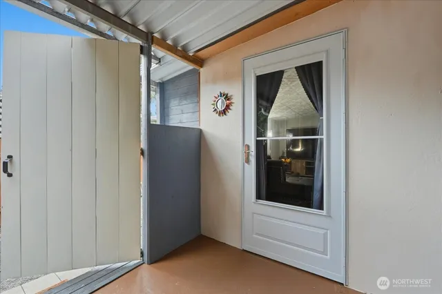 a view of livingroom with washer and dryer
