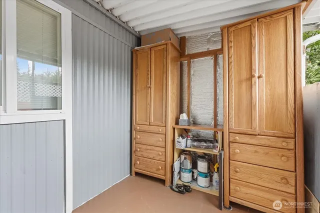 a view of walk in closet with clothes