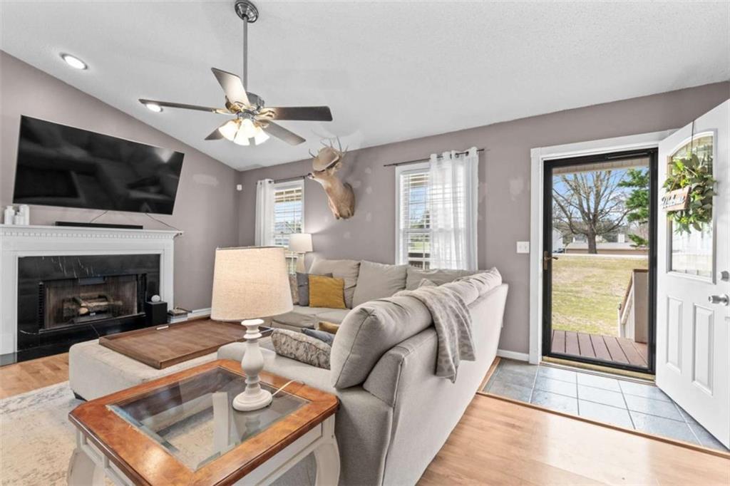 105 Chrissy Drive Temple, GA 30179 - Photo 11 of 47 a living room with furniture fireplace and flat screen tv