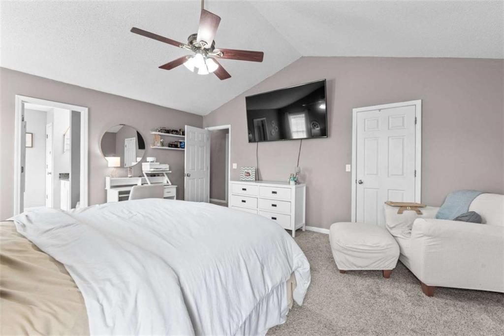 105 Chrissy Drive Temple, GA 30179 - Photo 23 of 47 a spacious bedroom with a bed and a couch