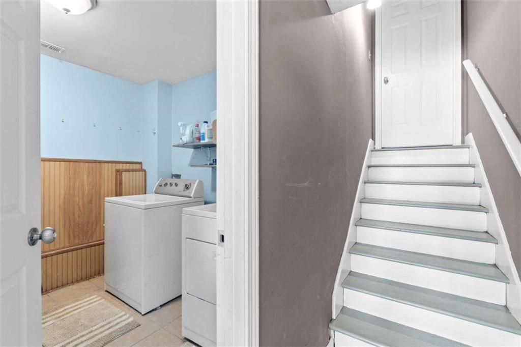 105 Chrissy Drive Temple, GA 30179 - Photo 31 of 47 a utility room with wooden floor washer and dryer