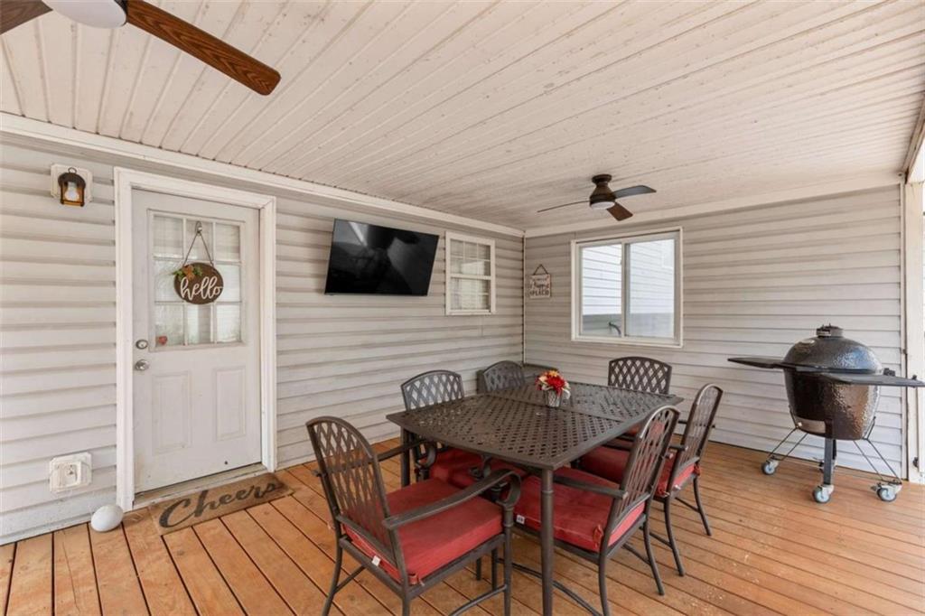 105 Chrissy Drive Temple, GA 30179 - Photo 41 of 47 a outdoor dining space with furniture and wooden floor