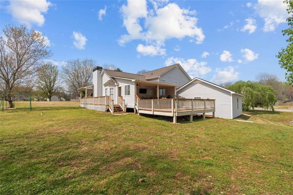 105 Chrissy Drive Temple, GA 30179 - Photo 43 of 47 a white house with a big yard and large trees