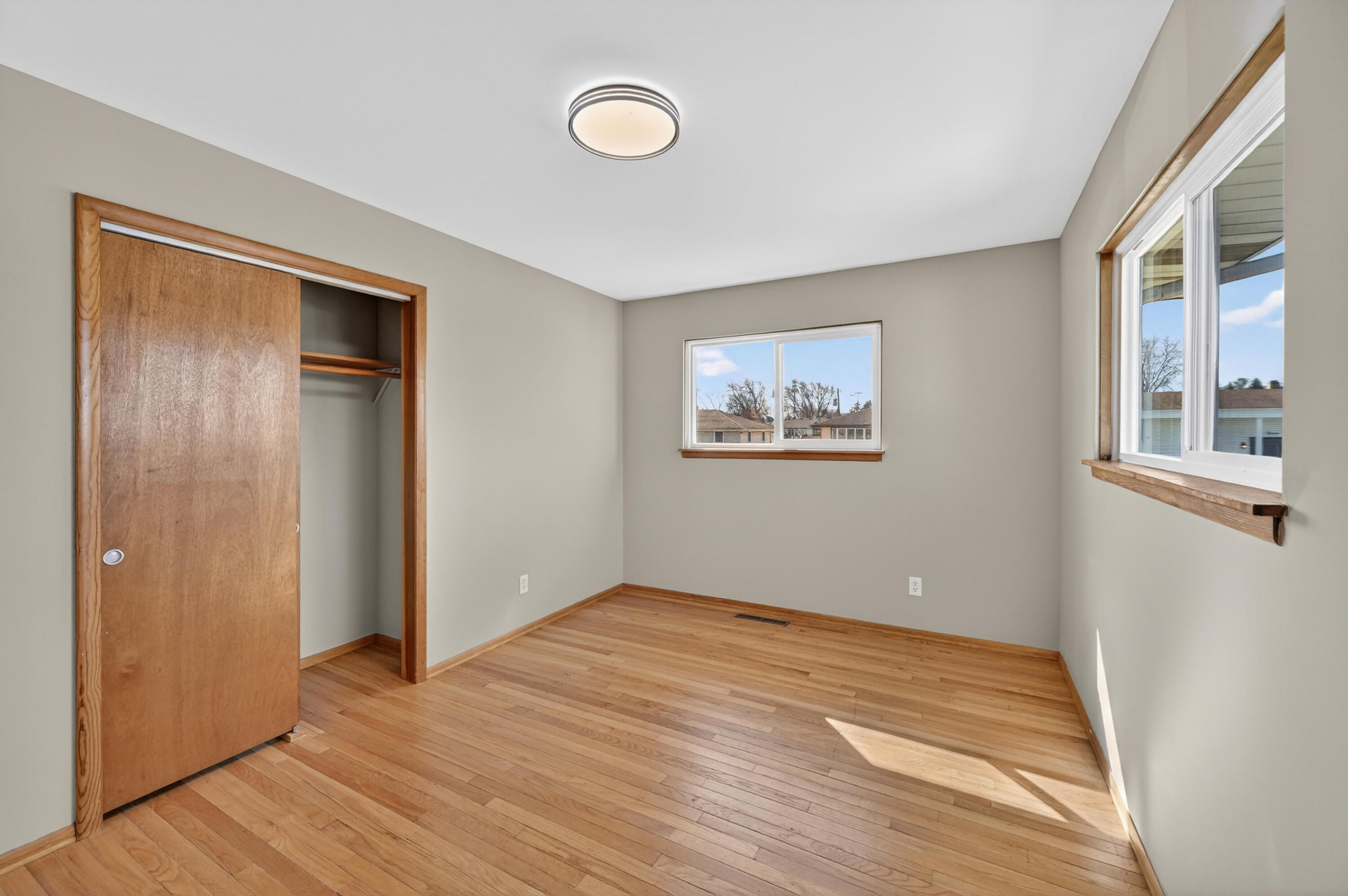 1006 West Ash Street Griffith, IN 46319 - Photo 17 of 25 a view of empty room with wooden floor and windows