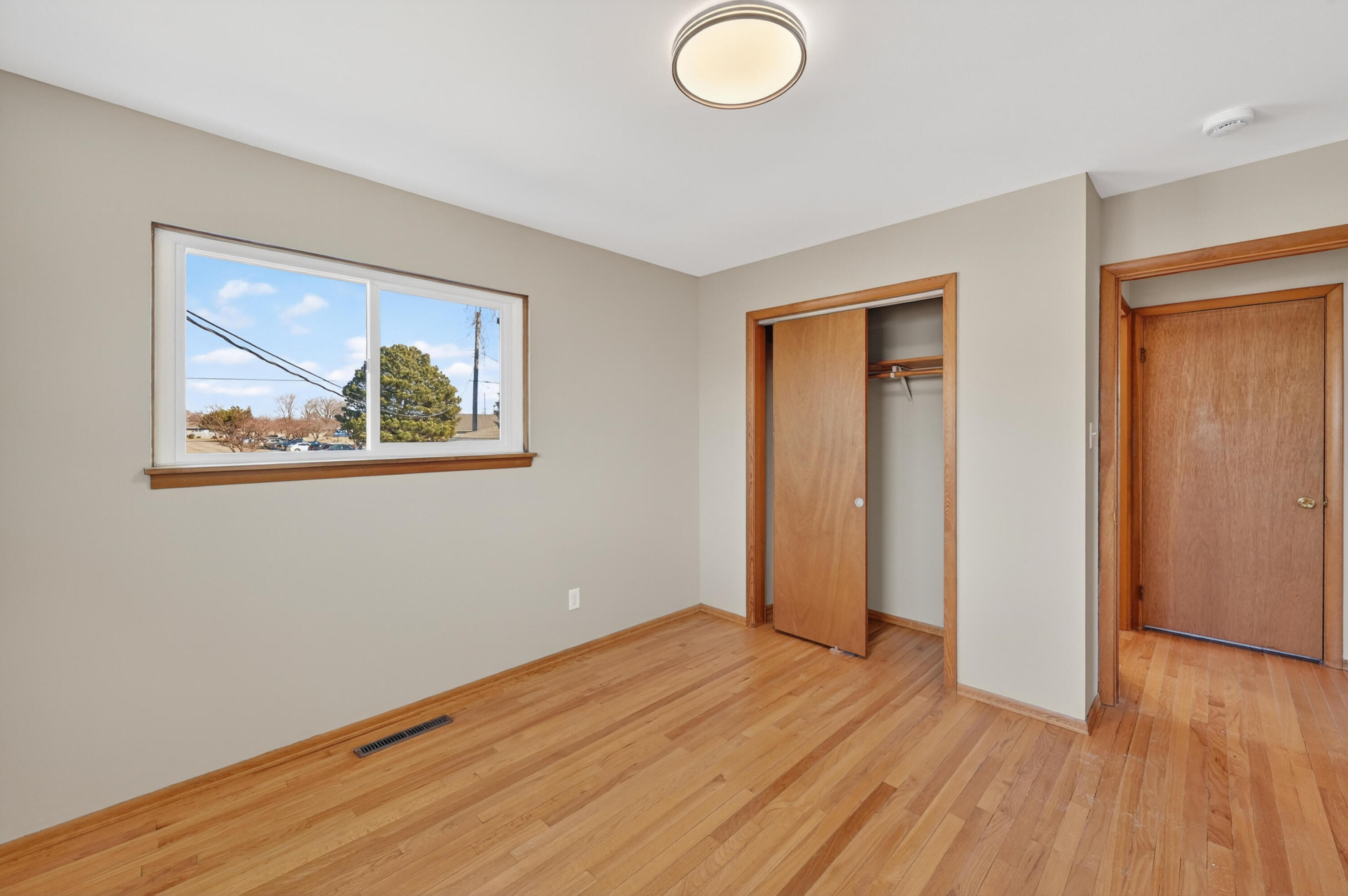 1006 West Ash Street Griffith, IN 46319 - Photo 19 of 25 a view of empty room with wooden floor and fan