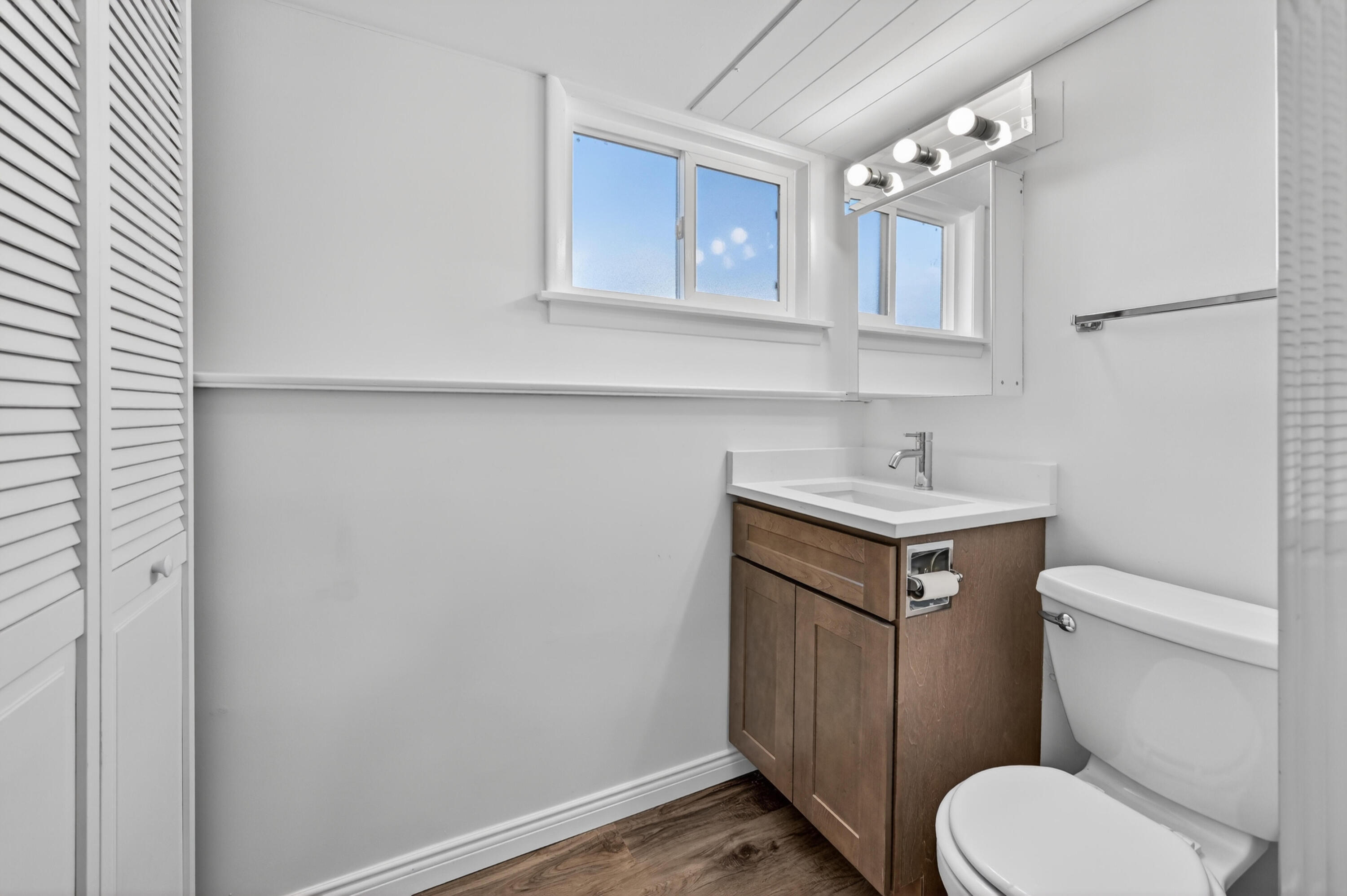 1006 West Ash Street Griffith, IN 46319 - Photo 25 of 25 a bathroom with a toilet sink and mirror