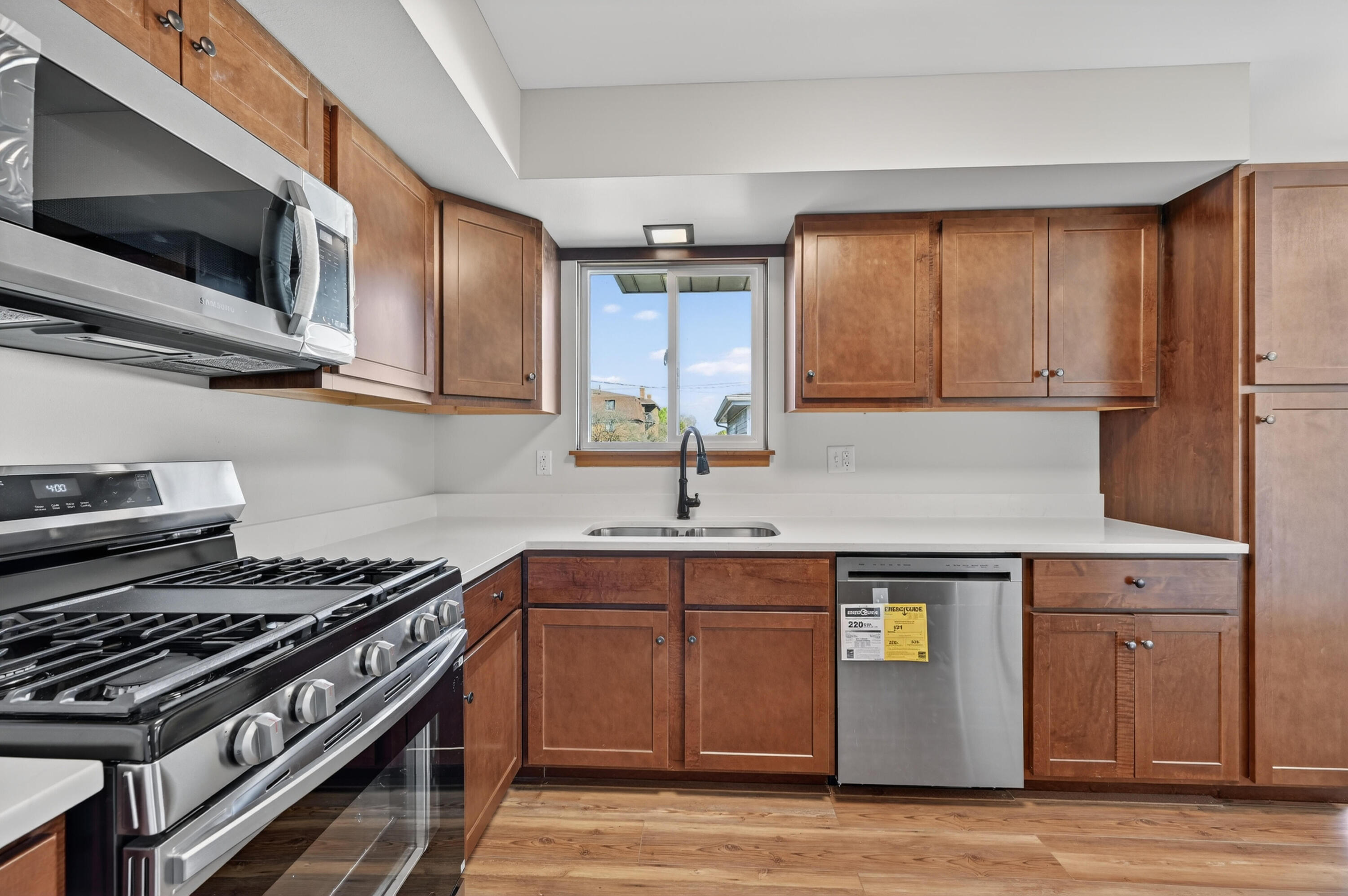 1006 West Ash Street Griffith, IN 46319 - Photo 8 of 25 a kitchen with stainless steel appliances granite countertop a sink stove top oven and cabinets