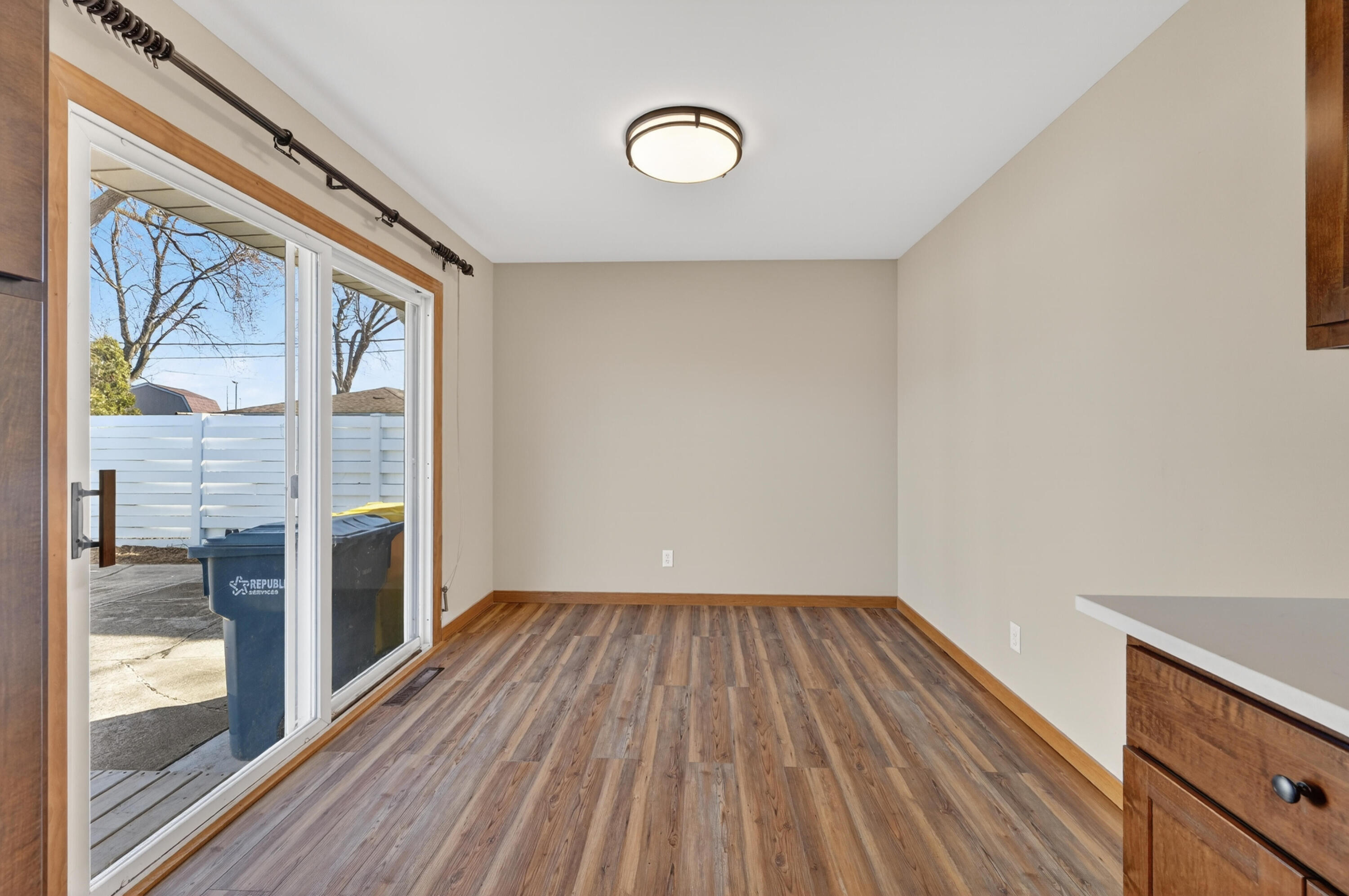 1006 West Ash Street Griffith, IN 46319 - Photo 9 of 25 a view of empty room with wooden floor and fan