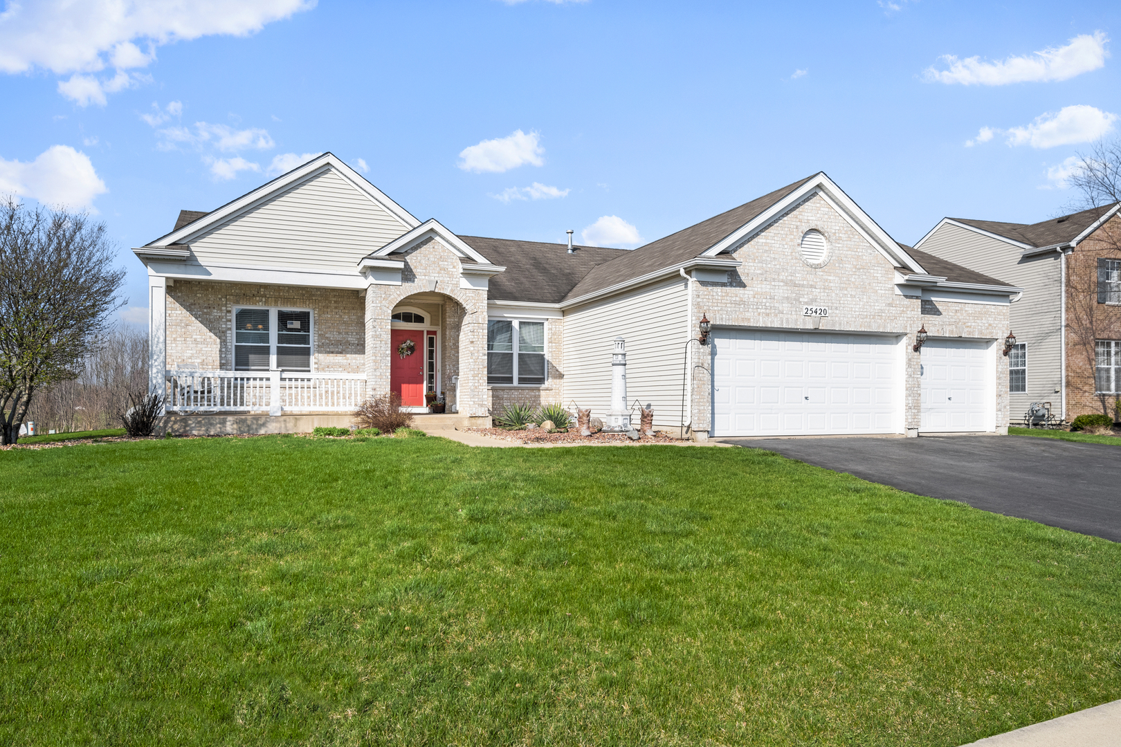 25420 Spring Street Manhattan, IL 60442 - Photo 2 of 27 a view of a house with a backyard