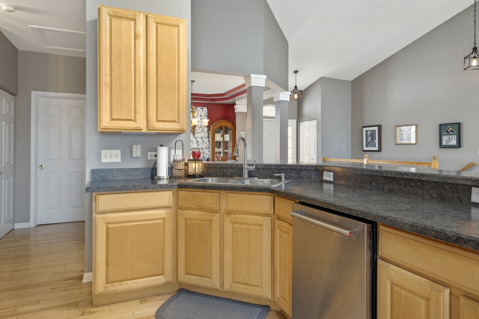 25420 Spring Street Manhattan, IL 60442 - Photo 12 of 27 a kitchen with stainless steel appliances granite countertop a sink and a wooden cabinets