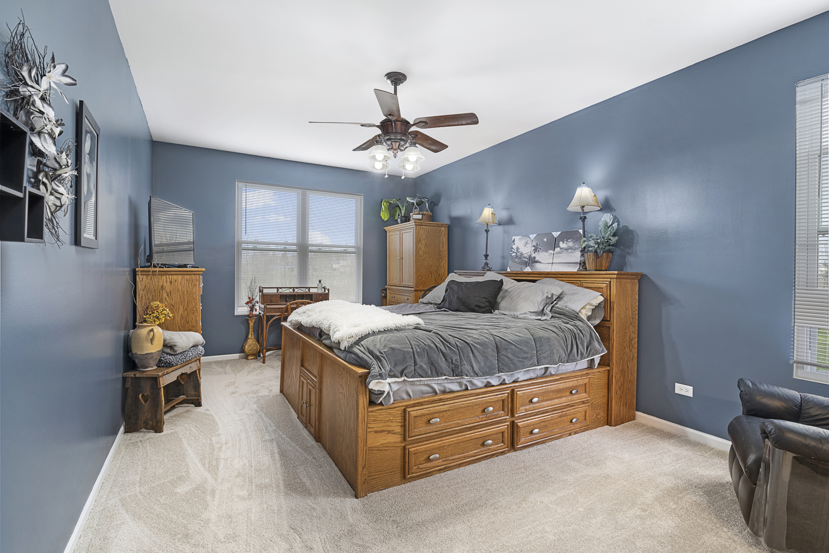 25420 Spring Street Manhattan, IL 60442 - Photo 15 of 27 a spacious bedroom with a bed and a chandelier