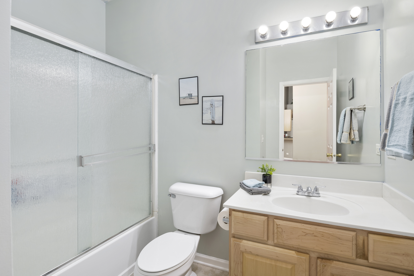 25420 Spring Street Manhattan, IL 60442 - Photo 18 of 27 a bathroom with a sink a toilet a mirror and shower